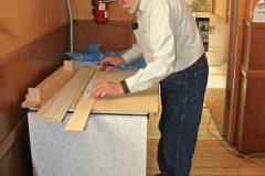 Workshop leader Ed Smith showing how to lay out the fuselage for cutting