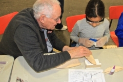 SOGGI member Ray Munro working with a young member building the balsa hand launch